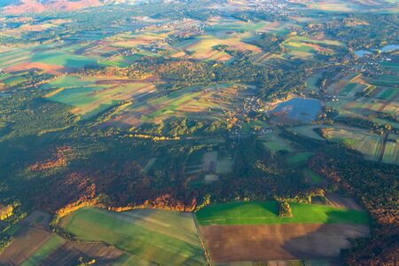 Aerial view background of Poland forests and hills in morning sunrise time. Autumn, Europe.