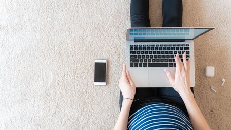 Yang woman working at home. Business female working on laptop. Lifestyle women working and study at home office concept. Flat lay top view copy space.の写真素材