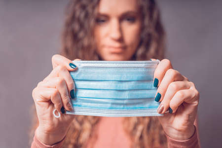 Health And Infection concept. Yang Woman wears Medical Face Mask against flu and viruses. Healthcare concept.の写真素材