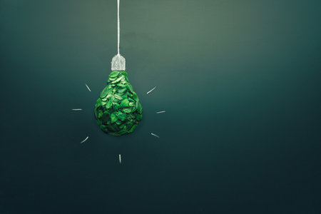 energy saving light bulb made with green leaves. Minimal nature concept. Think green. Ecology...
