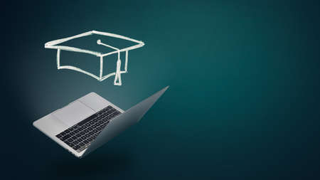 Eduction and graduation concept. Open laptop with hand drawn with graduation hat. Studying,...