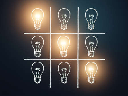 Goals concept with hand drawn light bulbs and tic-tac-toe game. Idea concept, Leadership, motivation, inspiration, symbol.の写真素材