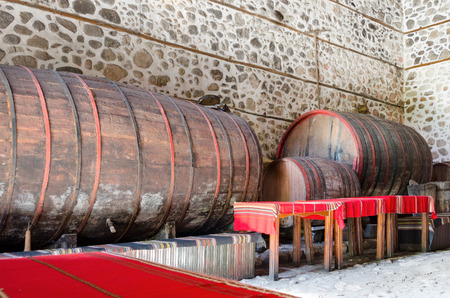 Wooden wine barrels in an underground cellar Melnik Bulgariaの写真素材