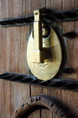 Detail of wood and metal old door with sharp spikes, Dubai, UAEのeditorial素材