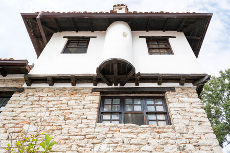 Typical old Bulgarian architecture of the house with a stone wall on the first floor, Balchik, Bulgariaのeditorial素材