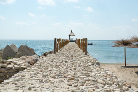 Nice pier/jetty of Black sea coast, Bulgaria. Sunny weather on the background.の写真素材