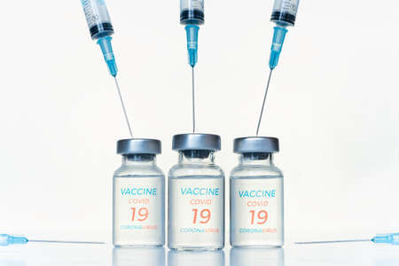 Transparent vials, syringes with new vaccine for covid-19 coronavirus, flu, infectious diseases....