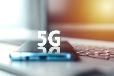 Mobile phone, smartphone with 5 G wireless high speed internet. Creative big white letters 5G on...