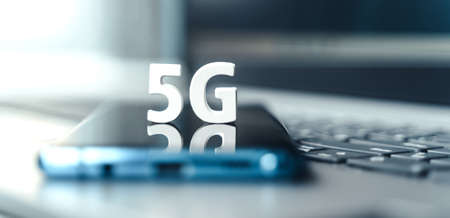 Mobile phone, smartphone with 5 G wireless high speed internet. Creative big white letters 5G on touch screen, reflection. Connection of cell, laptop for home, work, business.Modern technology concept.の写真素材