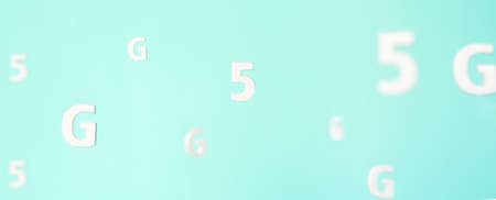 Pattern with large white flying letters 5 G on blue background. Creative concept. Modern wireless high speed mobile internet. Connection technology for cell, laptop, phone. Use at home, work, business.の写真素材