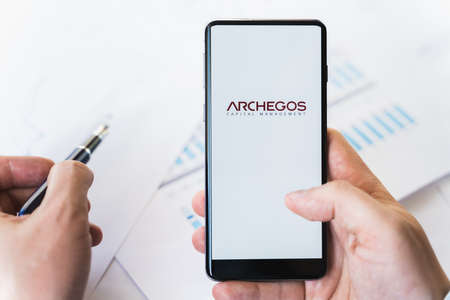 Russia Moscow 29.03.2021 Mobile phone with logo of Archegos Capital Management.Investment finance...