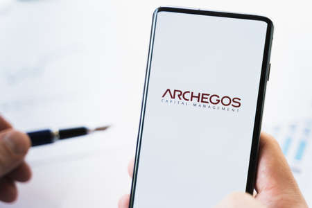 Russia Moscow 29.03.2021 Mobile phone with logo of Archegos Capital Management.Investment finance company,hedge fund.Margin call,bankruptcy,collapse,ruin.Loss of bank money.Falling stock market price.のeditorial素材
