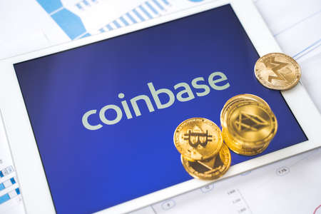 Russia Moscow 29.03.2021 Tablet with logo of cryptocurrency exchange Coinbase. Crypto coins company, service for buying, selling, trading, investing by market price. IPO start.Bitcoin,Ethereum,Ripple.のeditorial素材