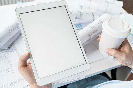 Working businessman investor.Blank tablet screen for mockup template.Financial...