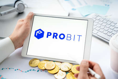 Russia Moscow 05/06/2021 Businessman with tablet.Logo of cryptocurrency stock exchange Probit.Trading blockchain platform to buy, sell digital crypto coins, tokens Bitcoin, Ethereum.Business, investing.のeditorial素材