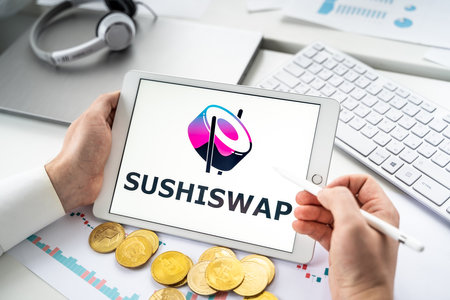 Russia Moscow 06.05.2021 Sushiswap logo.Cryptocurrency decentralized exchange DEX in tablet.Trading blockchain platform to swap,buy,sell crypto token,digital coin Bitcoin,Ethereum.Business,investing.のeditorial素材