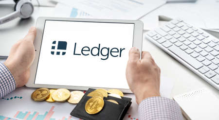 Russia Moscow 06.05.2021.Tablet with logo of Ledger hardware pocket wallet. Safe, secure vault for cryptocurrency, coins, tokens, nft digital assets.Storage for bitcoins, litecoins, passwords, logins, keys.のeditorial素材