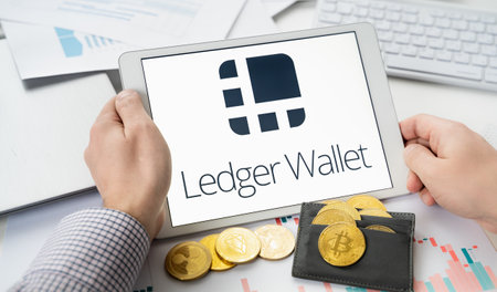 Russia Moscow 06.05.2021.Tablet with logo of Ledger hardware pocket wallet. Safe, secure vault for cryptocurrency, coins, tokens, nft digital assets.Storage for bitcoins, litecoins, passwords, logins, keys.のeditorial素材