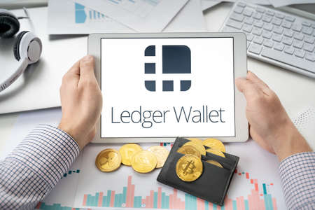 Russia Moscow 06.05.2021.Tablet with logo of Ledger hardware pocket wallet. Safe, secure vault for cryptocurrency, coins, tokens, nft digital assets.Storage for bitcoins, litecoins, passwords, logins, keys.のeditorial素材