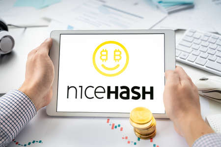 Russia Moscow 06.05.2021.Tablet, logo of cryptocurrency platform for mining, trading Nicehash.Exchange, blockchain application to buy store send, swap crypto coin, digital token.Bitcoin, Ethereum.Business.のeditorial素材