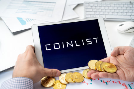Russia Moscow 06.05.2021.Tablet,logo of Coinlist, platform with new blockchain cryptocurrency startup companies, projets, wallets, exchange stocks. Buy, store, send, swap crypto coins digital tokens.のeditorial素材
