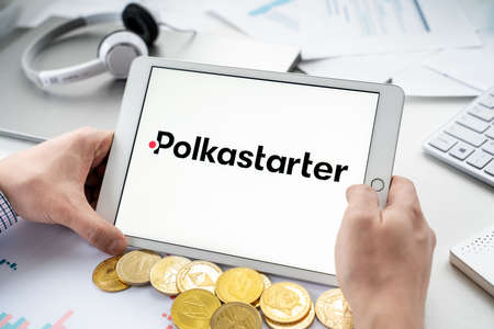 Russia Moscow 06.05.2021.Tablet with logo of Polkastarter, platform with presale of new crypto coins, tokens. Blockchain cryptocurrency startup companies, projets, wallets, exchange stocks.Crypto swap.のeditorial素材