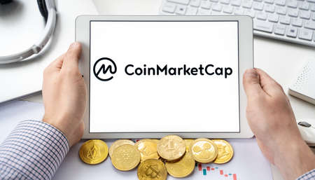 Russia Moscow 06.05.2021.Tablet with logo of Coinmarketcap, web site with rating, ranking of digital...