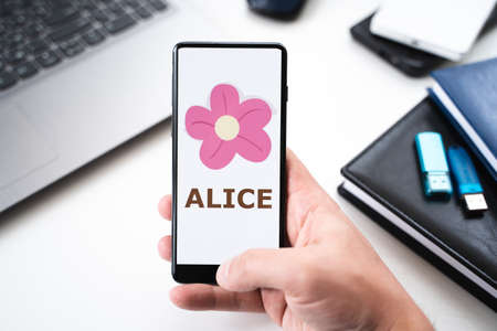 Russia Moscow 28.05.2021. Mobile phone with logo of blockchain gaming platform My Neighbor Alice. Binance Launchpool. Crypto coins, tokens mining online NFT staking system.Play, earn digital money.のeditorial素材