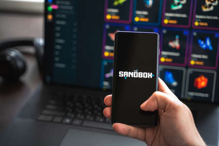 Russia Moscow 30.05.2021.Logo, screenshot of blockchain nft ethereum cryptocurrency game Sandbox in...