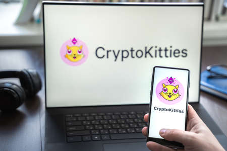 Russia Moscow 30.05.2021.Logo, screenshot of blockchain nft ethereum cryptocurrency game Cryptokitties in laptop screen. Man playing, collecting crypto kitties. Earning digital money at home.のeditorial素材