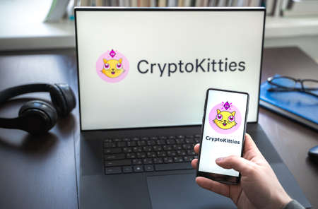 Russia Moscow 30.05.2021.Logo, screenshot of blockchain nft ethereum cryptocurrency game Cryptokitties in laptop screen. Man playing, collecting crypto kitties. Earning digital money at home.のeditorial素材
