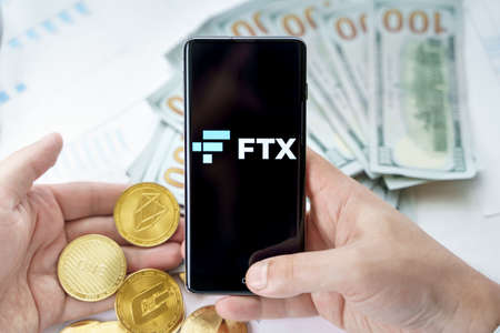 Russia Moscow 20.05.2021 FTX logo in mobile phone.Cryptocurrency decentralized exchange DEX.Trading blockchain platform.Swap,buy,sell crypto token,digital coin Bitcoin,Ethereum.Business,investing.のeditorial素材
