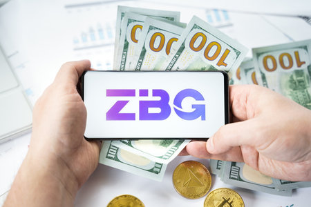 Russia Moscow 20.05.2021 ZBG Global leading logo in mobile phone.Cryptocurrency decentralized exchange DEX.Trading blockchain platform.Swap,buy,sell crypto token,digital coin Bitcoin,Ethereum.のeditorial素材