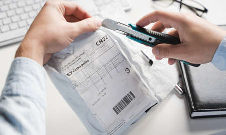 Russia Moscow 12.06.2021 Unpacking of box Trezor hardware,software pocket wallet.Accessory kit,password sheet.Safe,secure vault of cryptocurrency,coins,tokens,nft digital assets.Storage for login,key.のeditorial素材