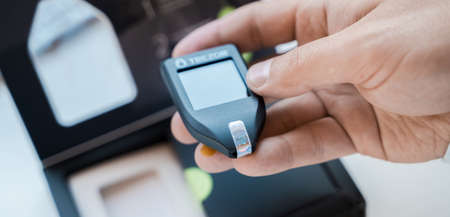 Russia Moscow 12.06.2021 Unpacking of box Trezor hardware,software pocket wallet.Accessory kit,password sheet.Safe,secure vault of cryptocurrency,coins,tokens,nft digital assets.Storage for login,key.のeditorial素材
