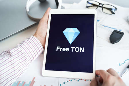 Moscow Russia 20.07.2021 Logo of Free Ton coin in mobile phone. Cryptocurrency TON token. Trading blockchain platform to buy,sell on decentralized exchange DEX. Digital money.Business,investing.のeditorial素材