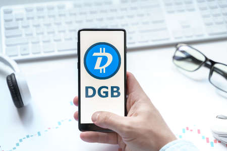 Russia Moscow 08.06.2021. Logo of cryptocurrency Digibyte, DGB crypto coin,token in mobile phone. Public decentralized payment wallet, system.のeditorial素材