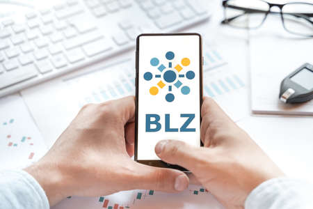 Logo of Bluzelle coin in tablet. Cryptocurrency BLZ token. Trading blockchain platform to buy,sell on decentralized exchange DEX,DEFI. Digital money.Business,investing.のeditorial素材
