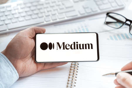 Logo of Medium web site, page in tablet. Open free blog platform for blogger, reader for writing article, posts on any topic. Social net,media resource for blogging. Business, news, information.のeditorial素材