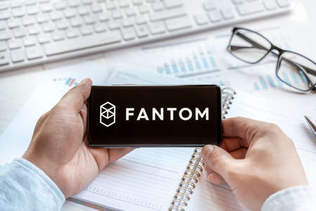 Fantom coin tablet. Cryptocurrency FTM token. Trading blockchain platform to buy,sell on decentralized exchange DEX,DEFI. Digital money.Business,investing.のeditorial素材