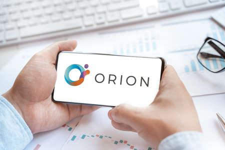 Logo of Orion Protocol in tablet. Cryptocurrency coin ORN token. Trading blockchain platform to buy,sell on decentralized exchange DEX,DEFI. Digital money.Business,investing.のeditorial素材