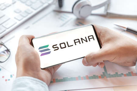 Solana coin tablet. Cryptocurrency SOL token. Trading blockchain platform to buy,sell on decentralized exchange DEX,DEFI. Digital money.Business,investing.のeditorial素材