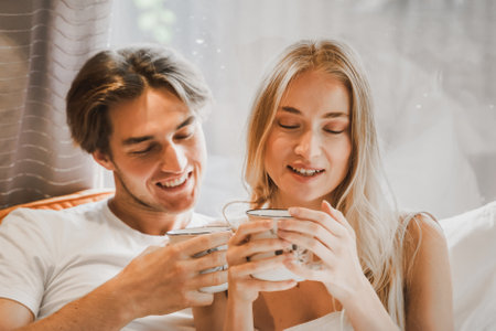 Young just married couple traveling in camper,house on wheels,trailer,motor home.Love romantic road travel,freedom life. Small bed,bedroom in van.Wanderlust vacation,weekend. Girl,guy,happy adventure.の写真素材