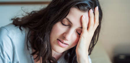 Sad, unhappy woman in depression. Stress, anxiety, tension, psychological problems. Poor mental health, visiting psychologist, psychotherapy session. Worries about work, family, divorce, unrequited love.の写真素材