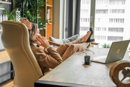 Confident stylish mature middle aged elderly woman in office. general manager, ceo Old senior businesswoman,60s lady in suit, executive business leader. Entrepreneur career.Accountant bank workplace.の写真素材