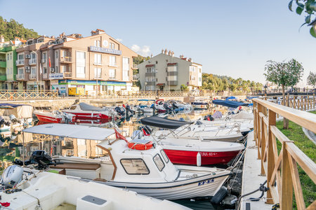 Turkey, Marmaris 24.12.2022 Motor and sail boats, yachts, launch in the water marina, dock, channel in the sunny sea port of the picturesque old city of Marmaris in Turkey.のeditorial素材