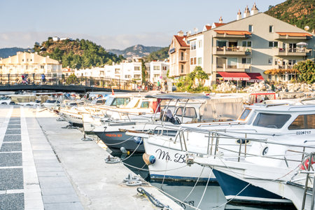 Turkey, Marmaris 24.12.2022 Motor and sail boats, yachts, launch in the water marina, dock, channel in the sunny sea port of the picturesque old city of Marmaris in Turkey.のeditorial素材