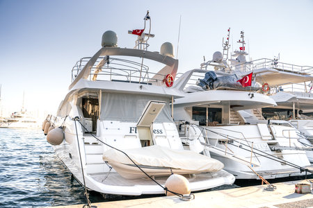 Turkey, Marmaris 24.12.2022 Motor and sail boats, yachts, launch in the water marina, dock, channel in the sunny sea port of the picturesque old city of Marmaris in Turkey.のeditorial素材
