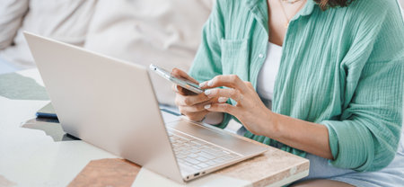 Girl,young woman with laptop.Online business meeting,interview,negotiations in cafe,restaurant. Remote work, business trip.Student studying in Internet.Education,learning.Talking with family,children.の写真素材