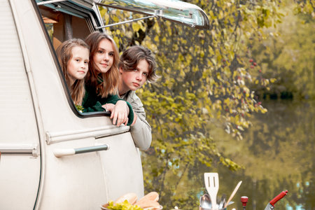 Children,family,brother sister traveling in camper,house on wheels. Trailer motor home.Looking in...